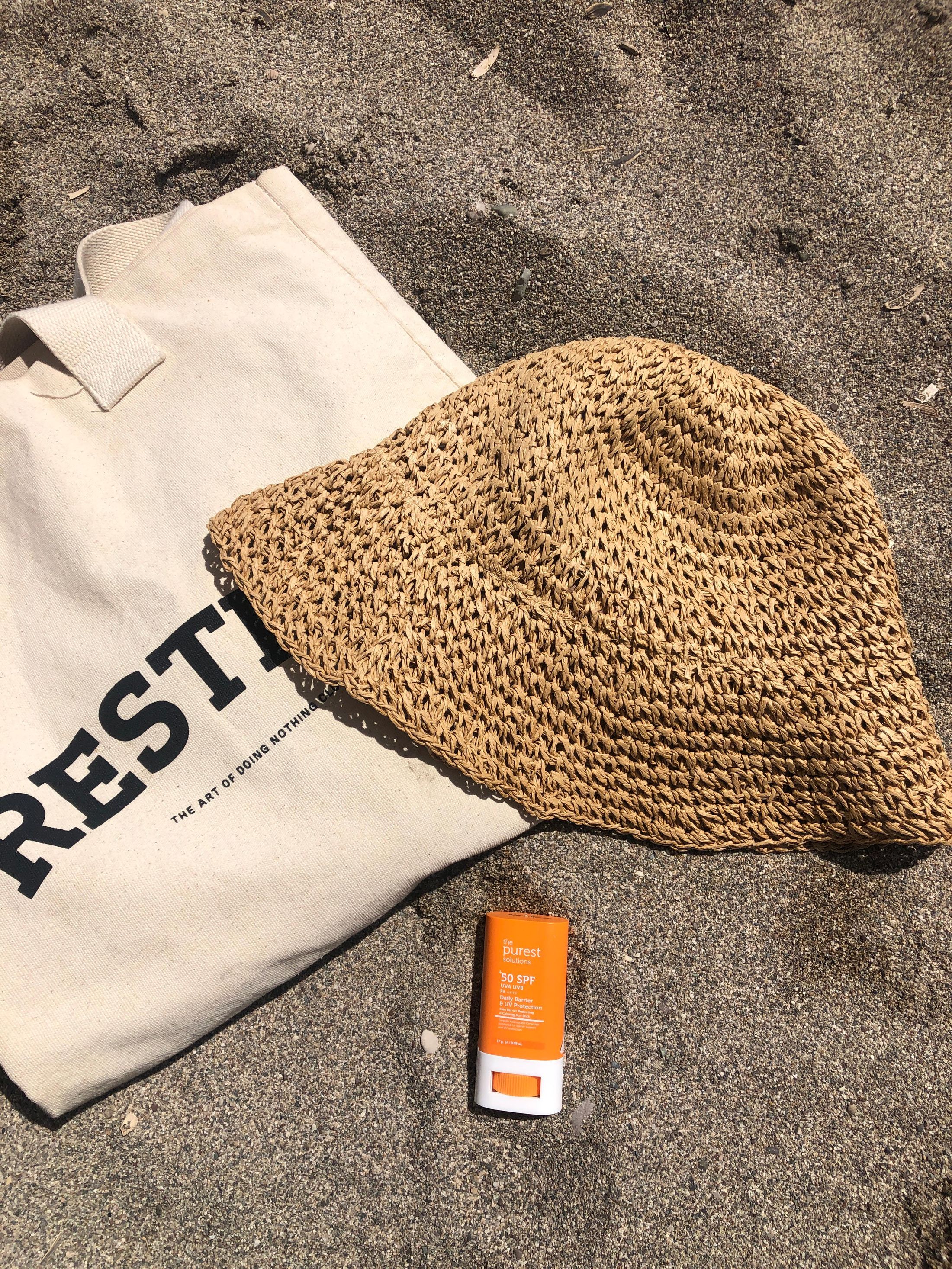 Beach essentials on sand for a summer Amazon Haul add-ons post